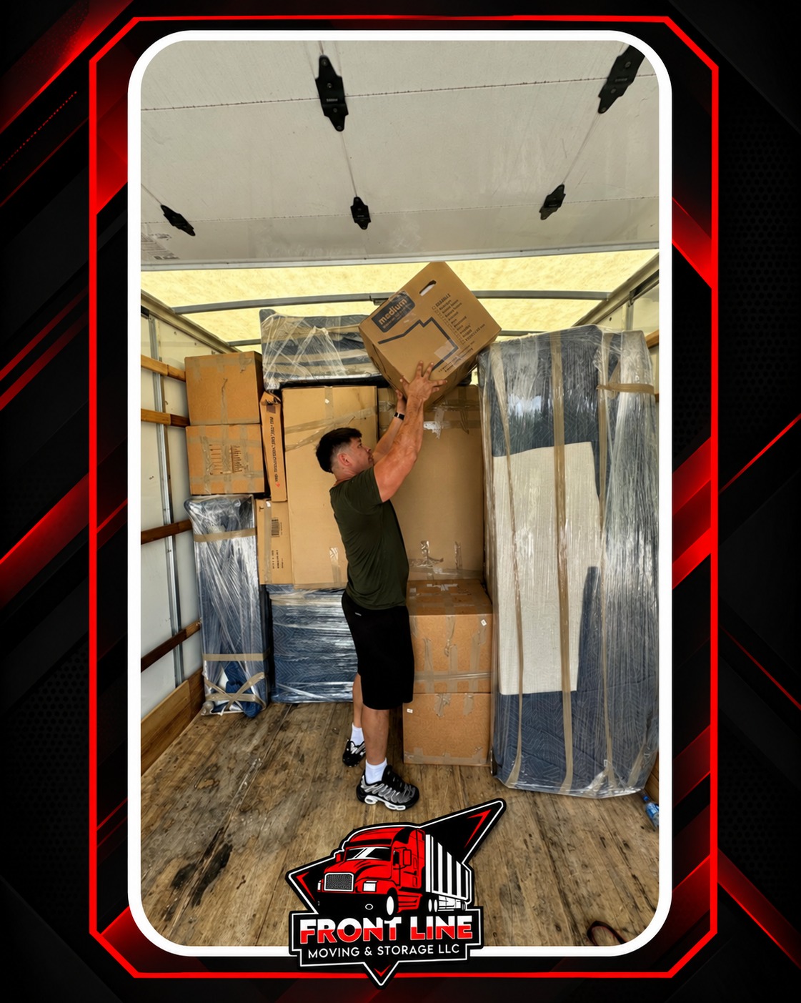 Front Line mover carefully loading a packed moving truck